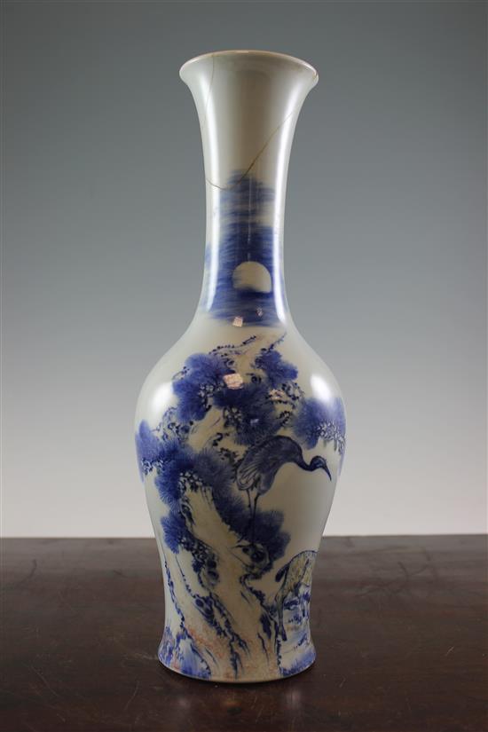 A Chinese underglaze blue and copper red crane and deer bottle vase, Kangxi six character mark, early 20th century, 39.5cm., neck rep